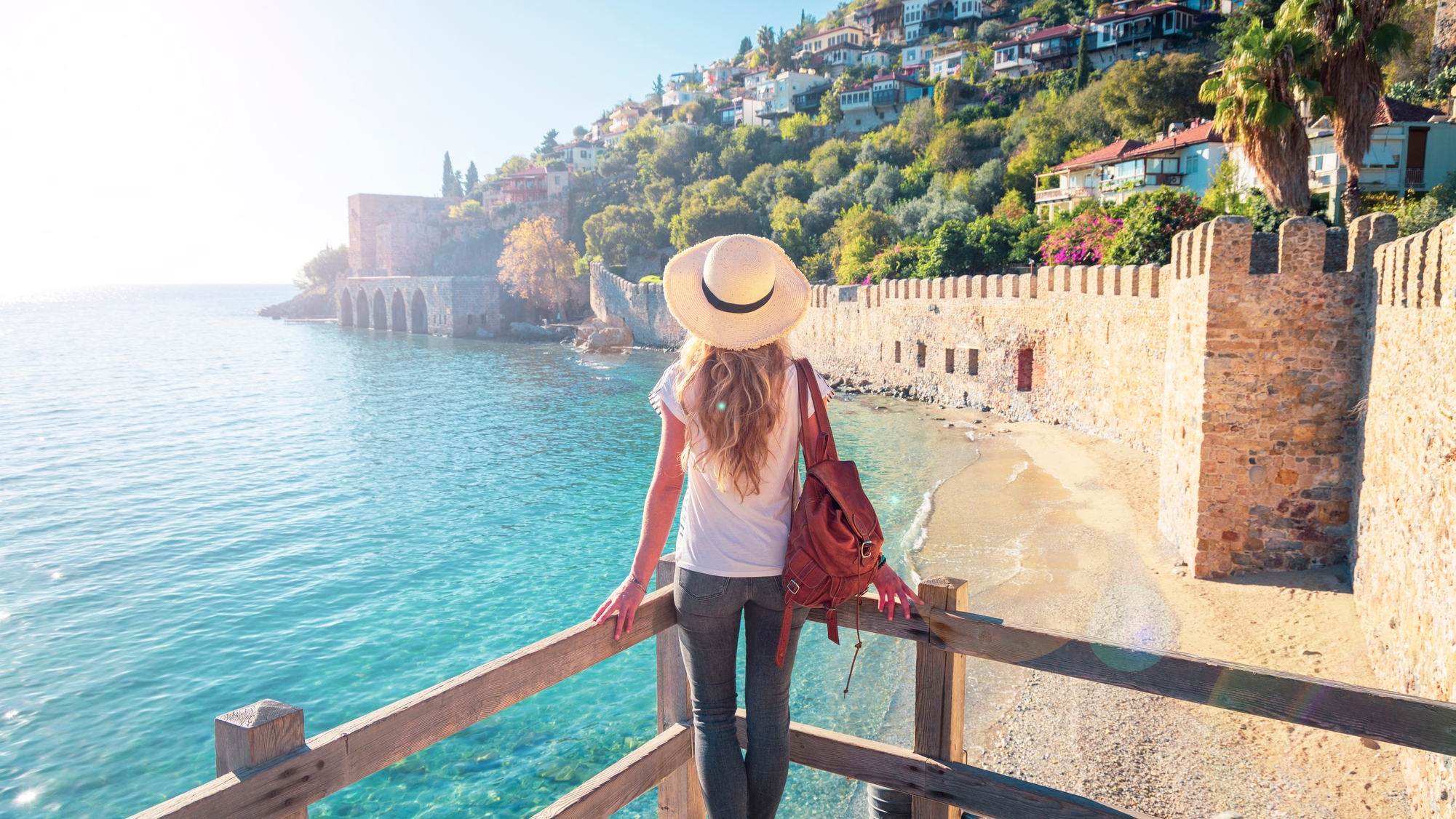 Young,Female,Tourist,Looking,At,Red,Tower,In,Alanya,,Antalya